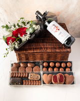 Non Alcoholic Wine, Chocolates and Flower Arranged in Bamboo Basket